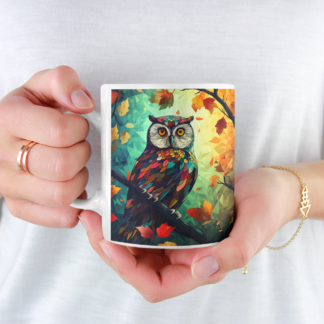 Welcome to our stunning forest collection of coffee mugs! This 11oz coffee mug features a colorful owl perched on a tree branch in a peaceful forest setting, making it the perfect addition to any nature lover's collection. Our mugs are made with high-quality ceramic materials that are both durable and dishwasher safe, ensuring that your owl mug will last for years to come. The vivid colors of the design are sure to stand out, making it a great conversation starter with friends and family over a hot cup of coffee or tea. This owl mug is just one of the many designs we offer in our forest collection, which includes a variety of beautiful creatures and landscapes found in the great outdoors. Whether you're an avid hiker, birdwatcher, or simply appreciate the natural beauty of the world around us, our collection has something for everyone. Our mugs make the perfect gift for any occasion, from birthdays to holidays, and are suitable for nature lovers of all ages. And with our fast and reliable shipping, you can enjoy your new owl mug in no time! So why wait? Add this beautiful owl mug to your collection today and enjoy the serenity of the forest every time you take a sip. And don't forget to check out our other forest-themed products to complete your collection! Warm-up with a nice cuppa out of this customized ceramic coffee mug. Personalize it with cool designs, photos or logos to make that "aaahhh!" moment even better. It’s BPA and Lead-free, microwave & dishwasher-safe, and made of white, durable ceramic in 11-ounce size. Thanks to the advanced printing tech, your designs come to life with incredibly vivid colors – the perfect gift for coffee, tea, and chocolate lovers. .: White ceramic .: 11 oz (0.33 l) .: Rounded corners .: C-handle .: Lead and BPA-free