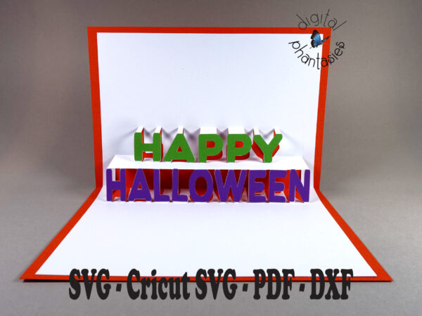 A greeting card with an orange base, with a white insert that has the words Happy Halloween popping up. Halloween is on the bottom and Happy centered above it. Individual letters spelling Happy Halloween are glued to the white insert of the card.