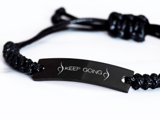 engraved Keep it going Neda symbol