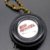 Meqasuring tape advertising "Big Wheel" tire center front view.